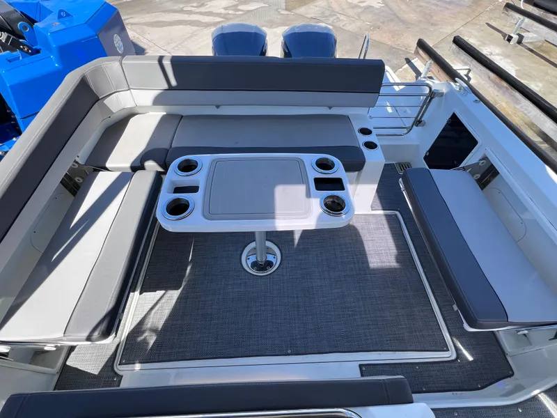 Slide: The Image of 2021 Jeanneau Leader 9.0 WA boat interior with seating and table. - 18