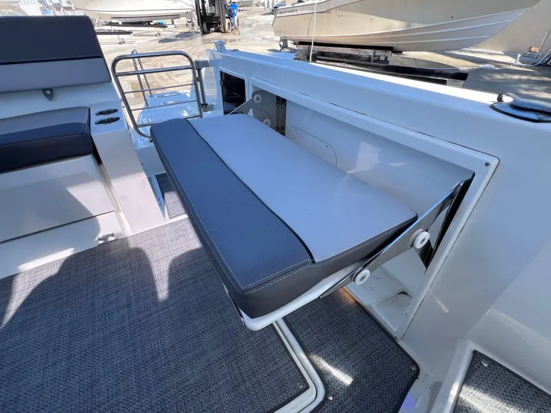 Slide: The Image of 2021 Jeanneau Leader 9.0 WA boat interior with foldable seat and modern design. - 19