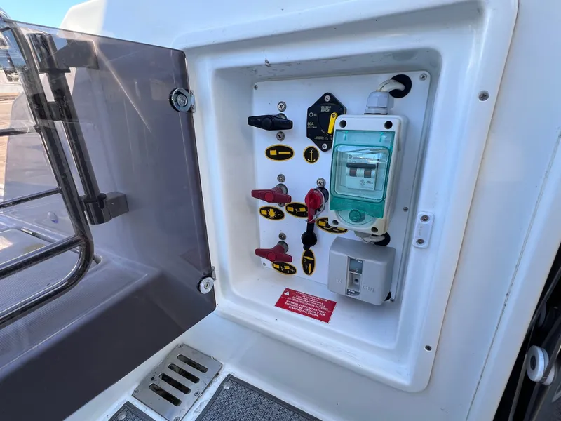 Slide: The Image of Electrical panel on 2021 Jeanneau Leader 9.0 WA boat, featuring switches and controls. - 24