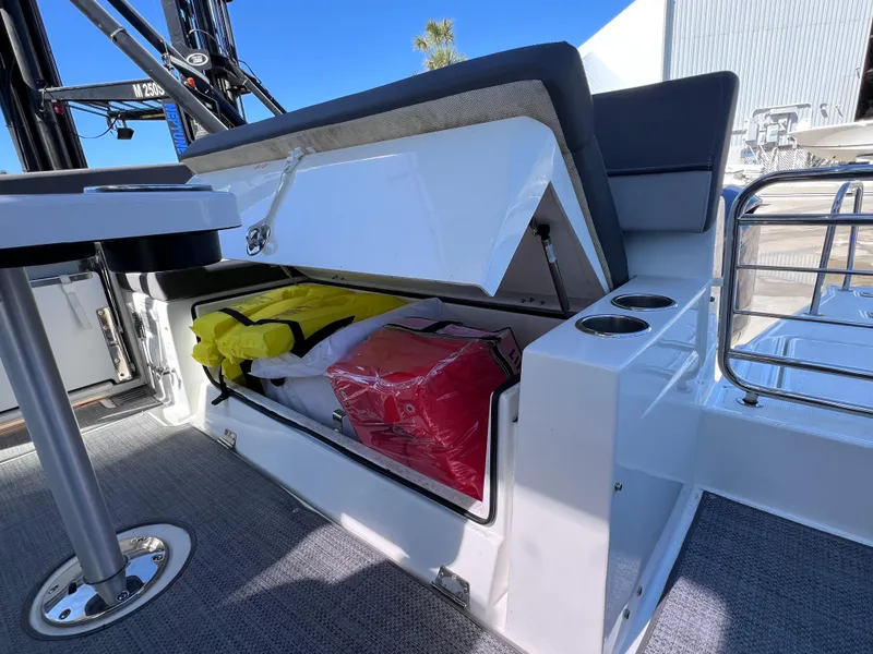 Slide: The Image of 2021 Jeanneau Leader 9.0 WA boat storage compartment with life jackets and accessories. - 25