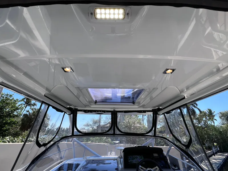 Slide: The Image of 2021 Jeanneau Leader 9.0 WA boat interior with sunroof and LED lighting. - 26