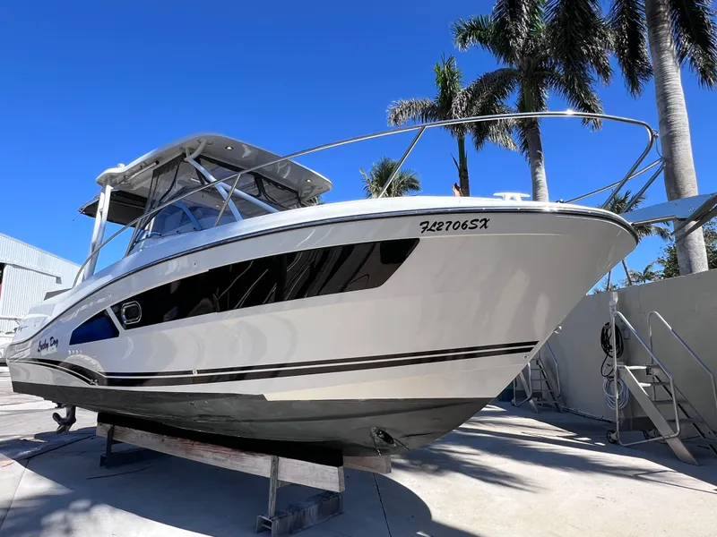 Slide: The Image of 2021 Jeanneau Leader 9.0 WA boat with twin Yamaha 250s, docked under clear blue sky. - 3