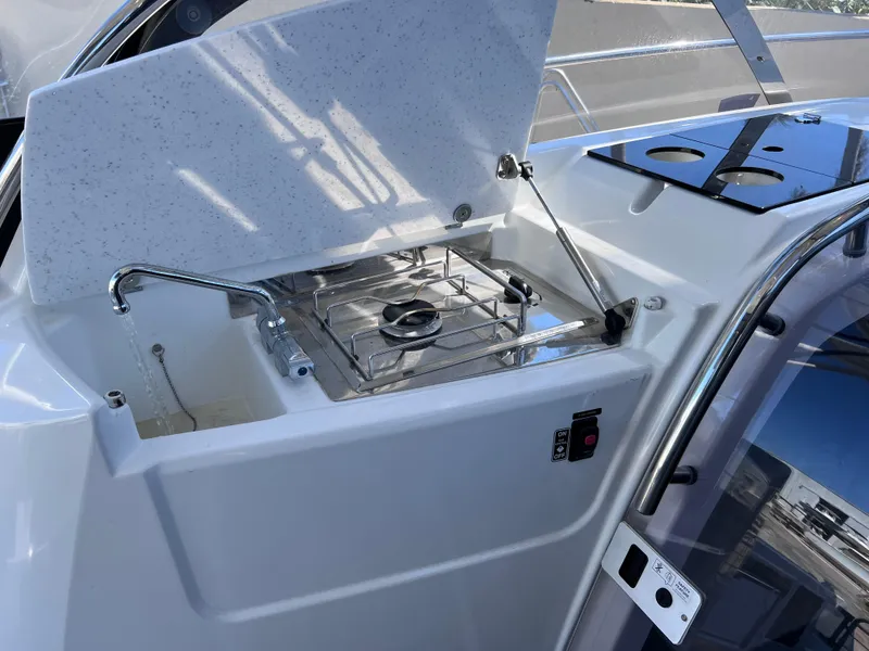 Slide: The Image of 2021 Jeanneau Leader 9.0 WA boat with open stove and sleek design. - 37