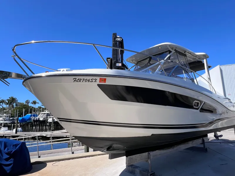 Slide: The Image of 2021 Jeanneau Leader 9.0 WA boat with twin Yamaha 250s, docked under clear blue sky. - 5