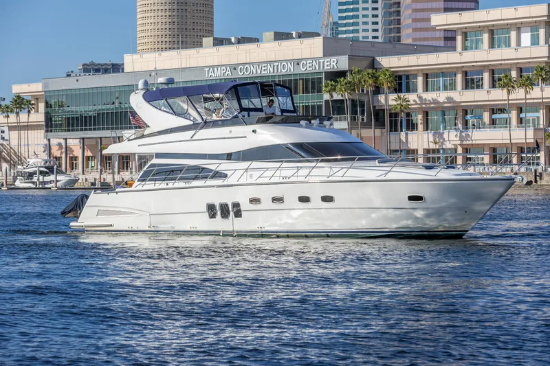Slide: The Image of 2007 Neptunus 62 Flybridge yacht near Tampa Convention Center, cruising on calm waters. - 0