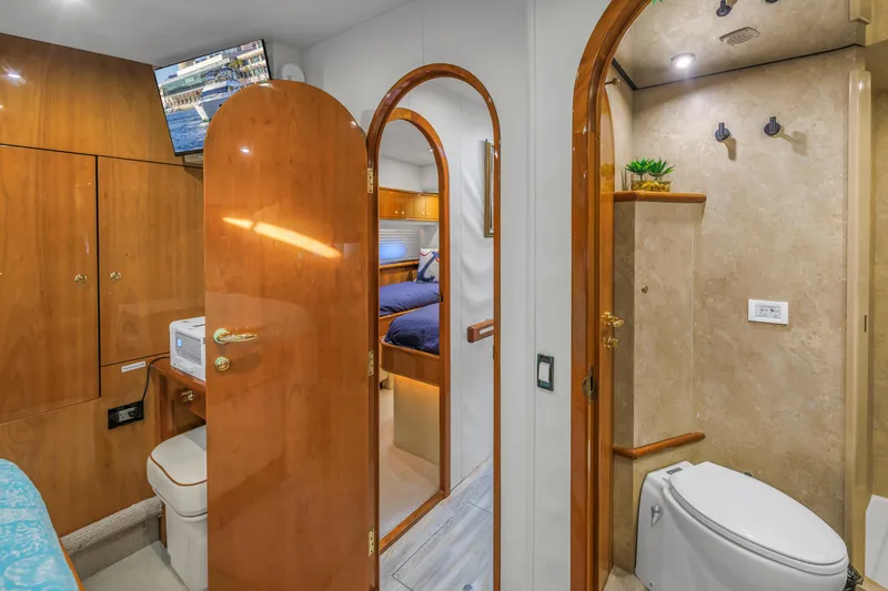 Slide: The Image of Luxurious 2007 Neptunus 62 Flybridge yacht interior with wood finishes and modern amenities. - 18