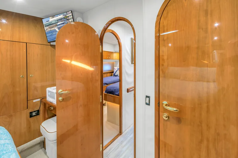 Slide: The Image of Luxurious 2007 Neptunus 62 Flybridge yacht interior with polished wood doors and modern amenities. - 19