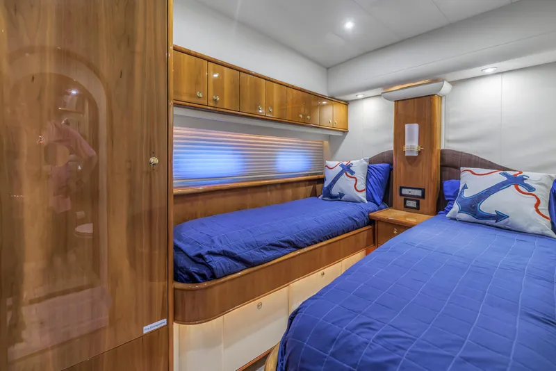 Slide: The Image of Luxurious 2007 Neptunus 62 Flybridge cabin with twin beds and nautical-themed decor. - 22