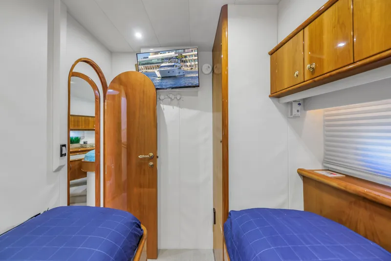 Slide: The Image of Interior of 2007 Neptunus 62 Flybridge yacht with twin beds and wooden cabinetry. - 23