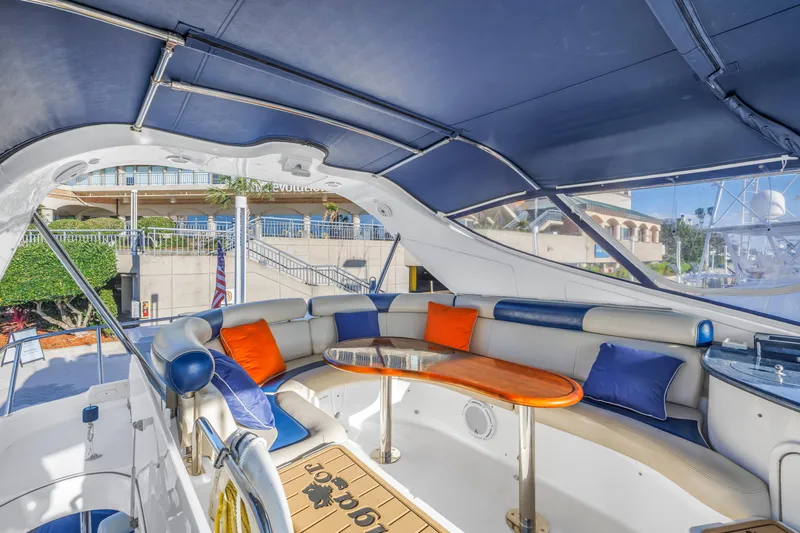 Slide: The Image of Luxurious 2007 Neptunus 62 Flybridge yacht with spacious seating and vibrant cushions. - 25