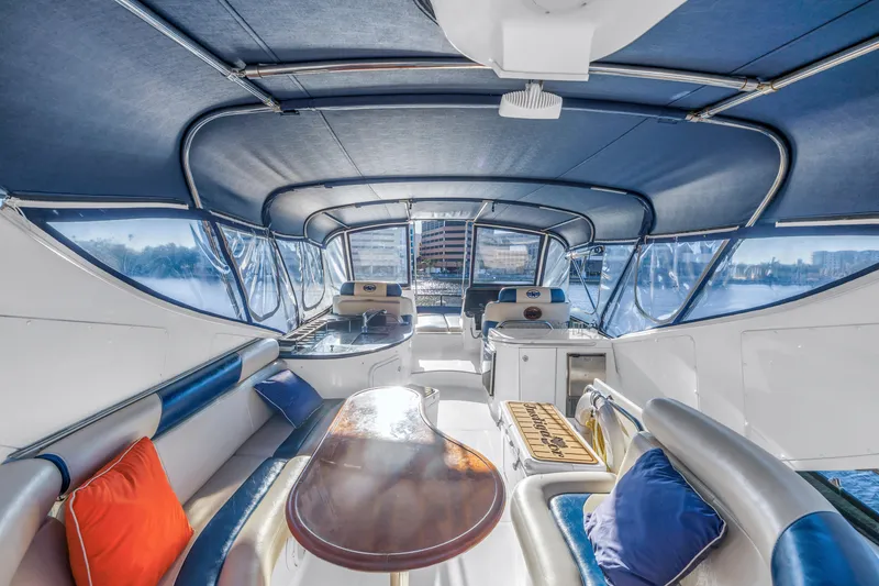 Slide: The Image of Luxurious 2007 Neptunus 62 Flybridge yacht interior with elegant seating and vibrant cushions. - 27