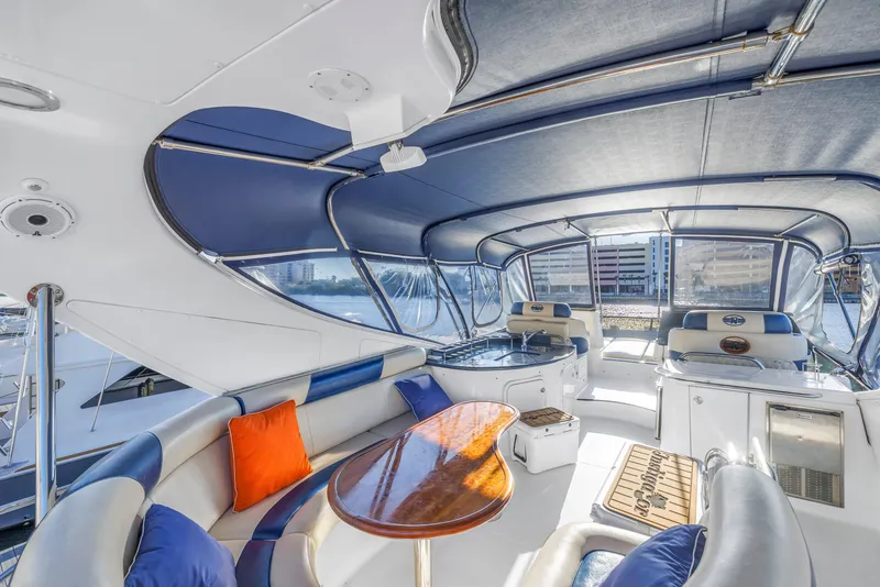 Slide: The Image of Luxurious 2007 Neptunus 62 Flybridge yacht interior with elegant seating and panoramic views. - 29