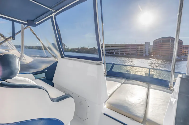 Slide: The Image of Luxurious 2007 Neptunus 62 Flybridge yacht interior with sunlit seating and waterfront view. - 35
