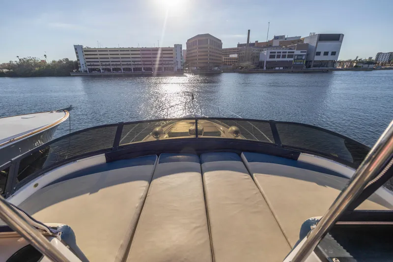 Slide: The Image of 2007 Neptunus 62 Flybridge yacht on water, cityscape in background, sunny day. - 37