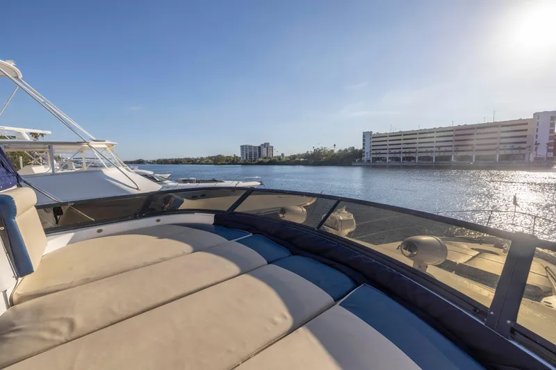 Slide: The Image of Luxurious 2007 Neptunus 62 Flybridge yacht with spacious deck, docked by serene waterfront. - 38