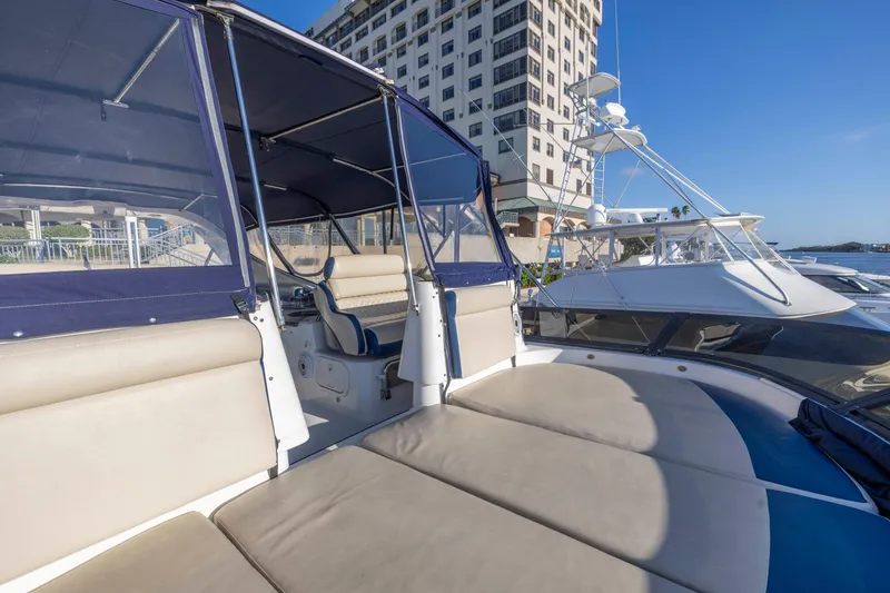 Slide: The Image of 2007 Neptunus 62 Flybridge yacht docked near a tall building. - 39