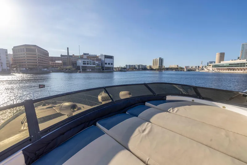 Slide: The Image of 2007 Neptunus 62 Flybridge yacht on a sunny waterfront cityscape. - 40
