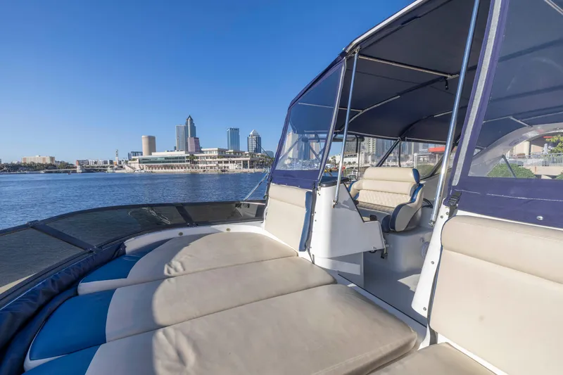 Slide: The Image of 2007 Neptunus 62 Flybridge yacht with city skyline in the background. - 41