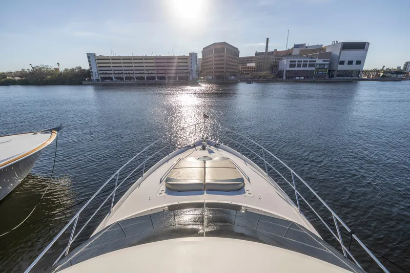 Slide: The Image of Bow view of 2007 Neptunus 62 Flybridge yacht on calm water near urban buildings. - 42