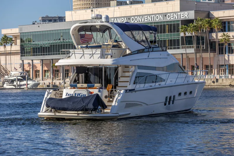 Slide: The Image of 2007 Neptunus 62 Flybridge yacht near Tampa Convention Center, docked on calm water. - 5