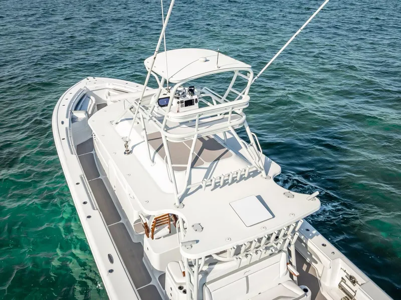 Slide: The Image of 2023 Yellowfin 54 boat on clear blue water, aerial view. - 16