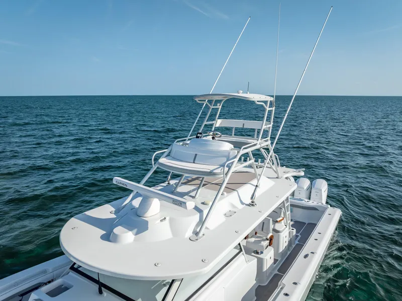 Slide: The Image of 2023 Yellowfin 54 boat on open sea, showcasing sleek design and advanced features. - 21