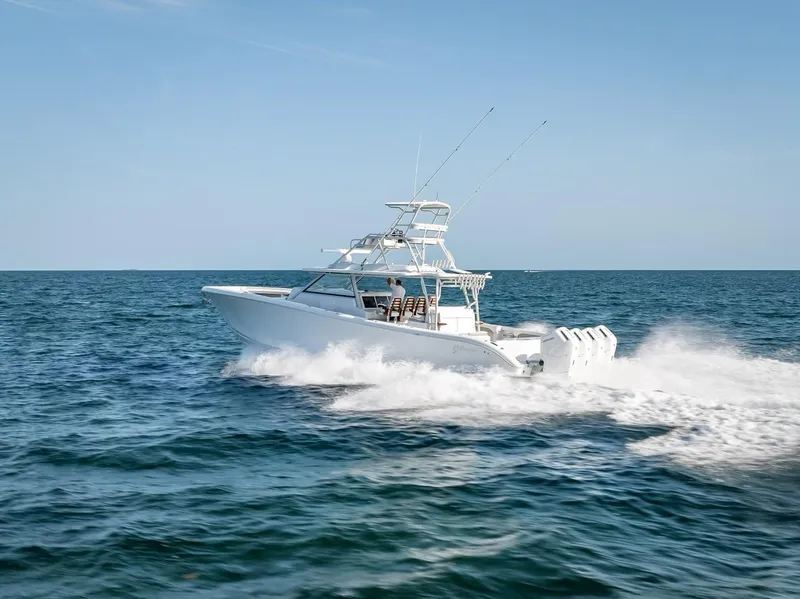 Slide: The Image of 2023 Yellowfin 54 boat cruising on open water, showcasing sleek design and powerful engines. - 31