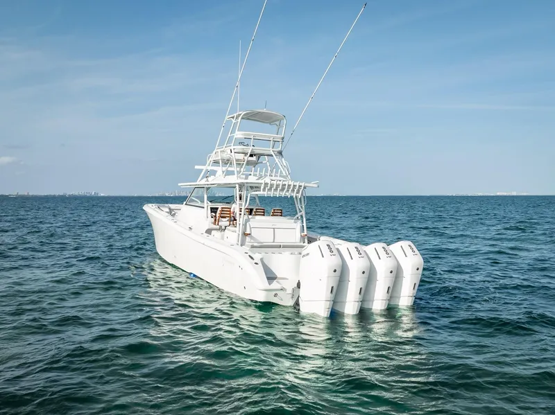 Slide: The Image of 2023 Yellowfin 54 boat with multiple engines on open water. - 41