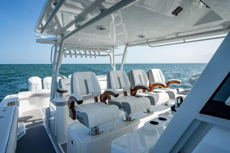 Slide: The Image of 2023 Yellowfin 54 boat interior with luxurious seating on open water. - 47