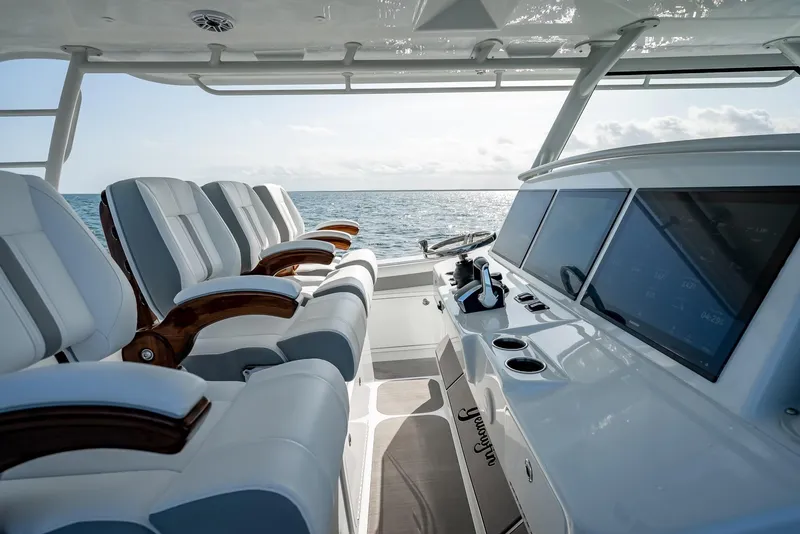Slide: The Image of 2023 Yellowfin 54 boat interior with luxurious seating and advanced navigation system. - 49