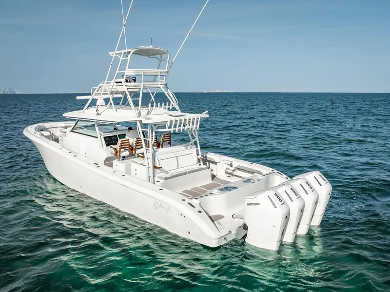 Slide: The Image of 2023 Yellowfin 54 boat with multiple outboard engines on open sea. - 7