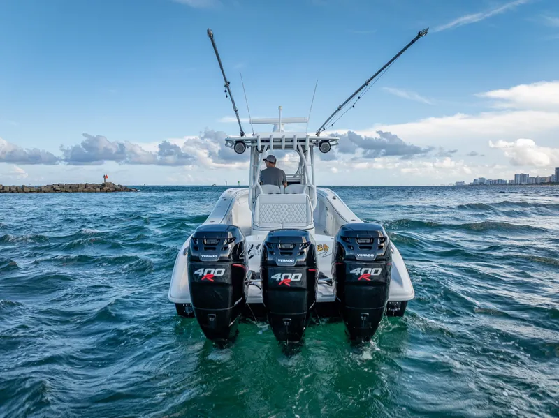 Slide: The Image of 2019 Yellowfin 34 boat with triple 400 horsepower engines on open water. - 13