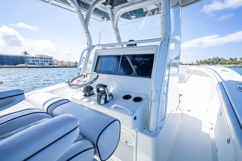 Slide: The Image of 2019 Yellowfin 34 boat interior with steering wheel and navigation screens. - 18
