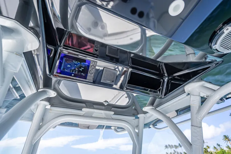 Slide: The Image of 2019 Yellowfin 34 boat console with advanced navigation system and sleek design. - 19
