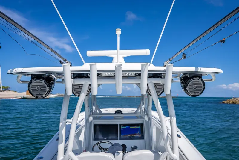 Slide: The Image of 2019 Yellowfin 34 boat with advanced navigation system on open water. - 23