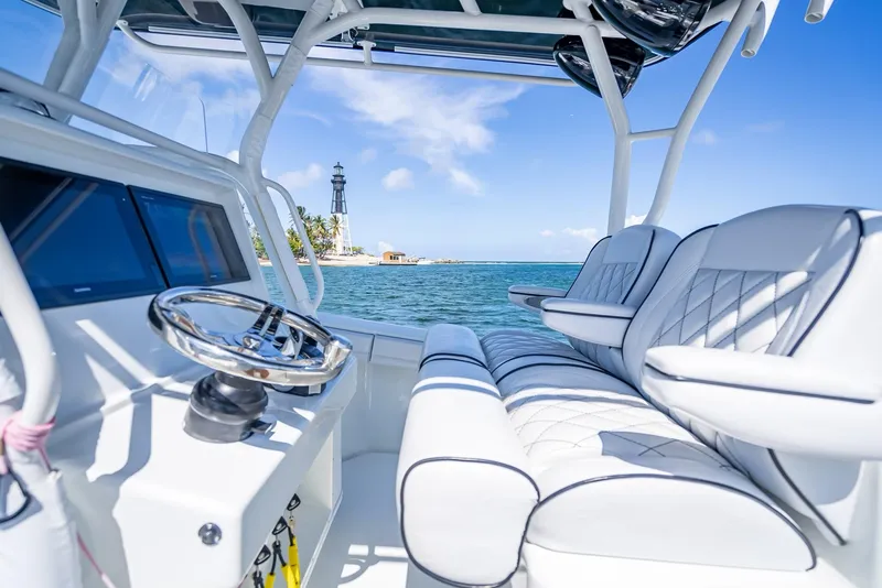 Slide: The Image of 2019 Yellowfin 34 boat interior with ocean view and distant lighthouse. - 26