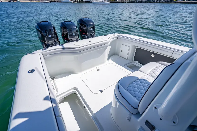 Slide: The Image of 2019 Yellowfin 34 boat with triple outboard engines on calm water. - 27