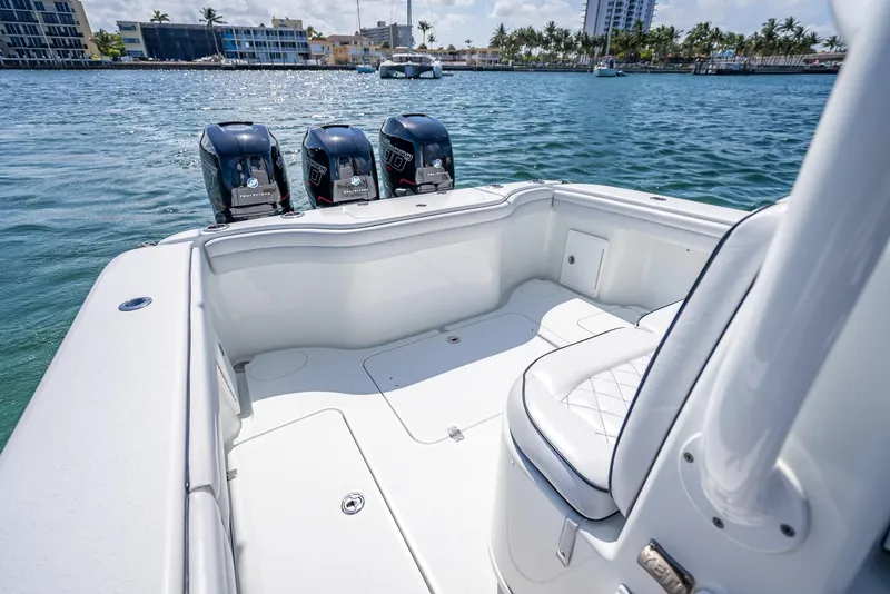 Slide: The Image of 2019 Yellowfin 34 boat with triple outboard engines on calm water. - 28