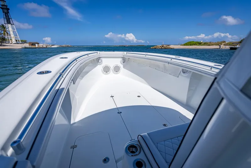 Slide: The Image of 2019 Yellowfin 34 boat on calm waters under a clear blue sky. - 34