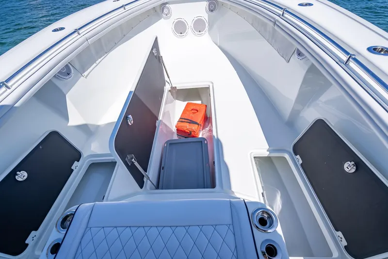 Slide: The Image of 2019 Yellowfin 34 boat interior with storage compartments and safety equipment. - 40