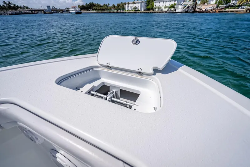 Slide: The Image of 2019 Yellowfin 34 boat with open anchor hatch on calm water. - 42