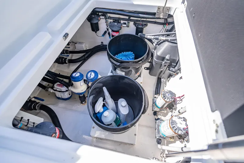Slide: The Image of 2019 Yellowfin 34 boat storage compartment with cleaning supplies and equipment. - 46