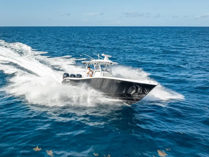 Slide: The Image of 2019 Yellowfin 34 boat cruising on open ocean waters. - 5