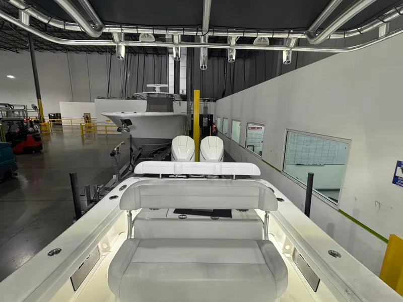 Slide: The Image of 2019 Yellowfin 26 Hybrid boat interior in a warehouse setting. - 15
