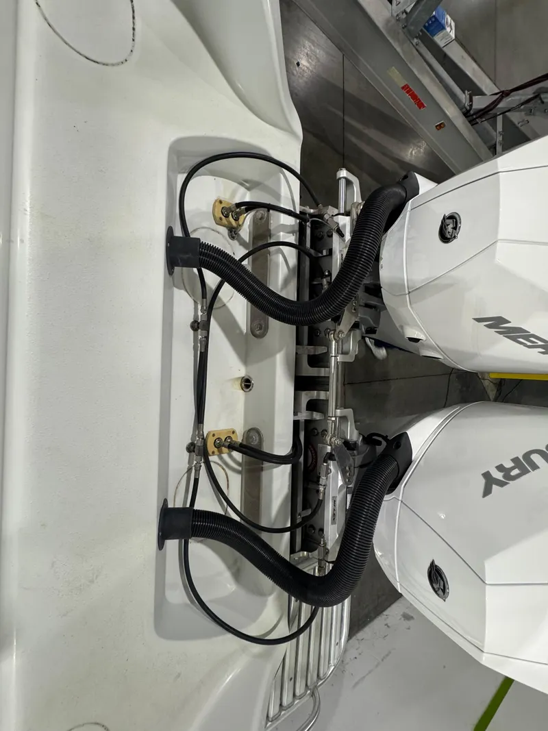 Slide: The Image of 2019 Yellowfin 26 Hybrid boat with dual Mercury outboard engines, rear view. - 20