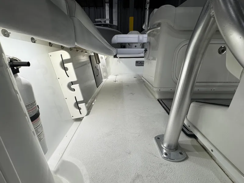 Slide: The Image of 2019 Yellowfin 26 Hybrid boat interior, featuring seating and storage compartments. - 21