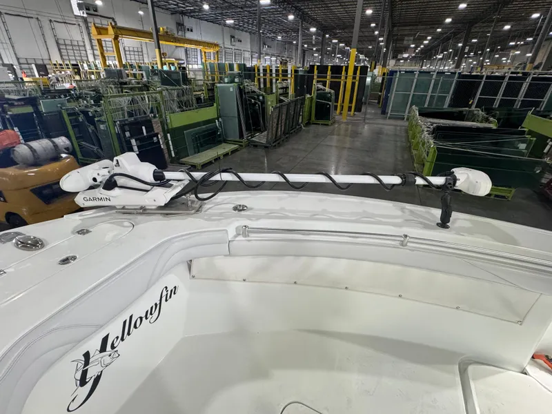 Slide: The Image of 2019 Yellowfin 26 Hybrid boat with Garmin equipment in an industrial setting. - 24