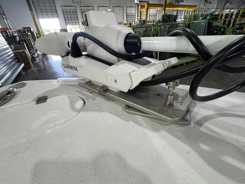 Slide: The Image of 2019 Yellowfin 26 Hybrid boat with Garmin equipment in a warehouse setting. - 25