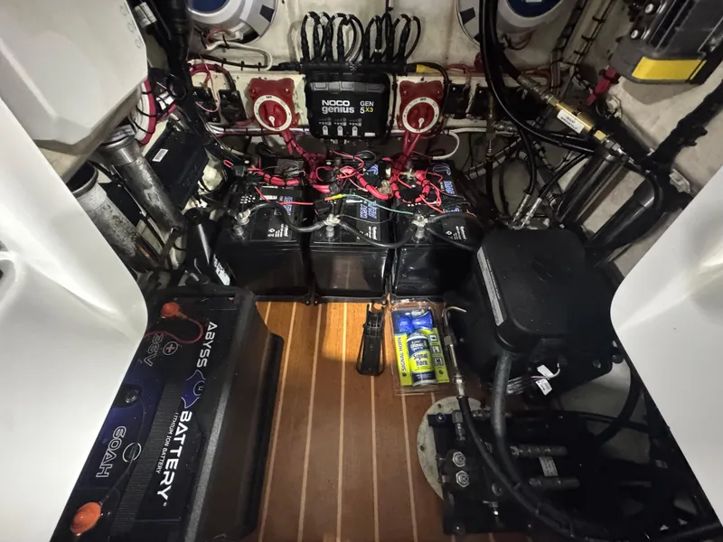 Slide: The Image of 2019 Yellowfin 26 Hybrid boat battery compartment with wiring and equipment. - 27