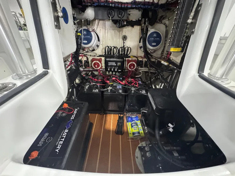 Slide: The Image of 2019 Yellowfin 26 Hybrid boat interior showing battery and wiring setup. - 28